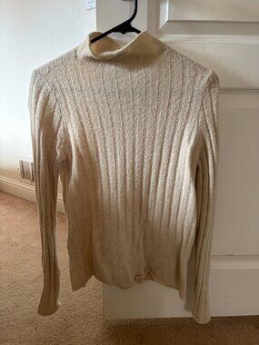 Tan ribbed turtleneck sweater